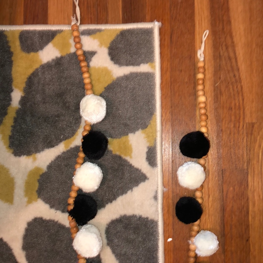 two decorative strings w/ wooden beads&pom-pom’s